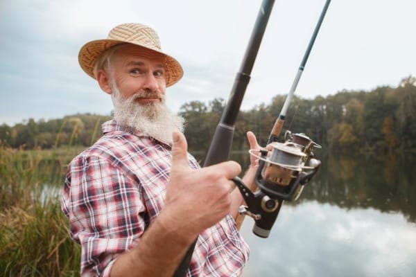 Fisherman using two rods 827552