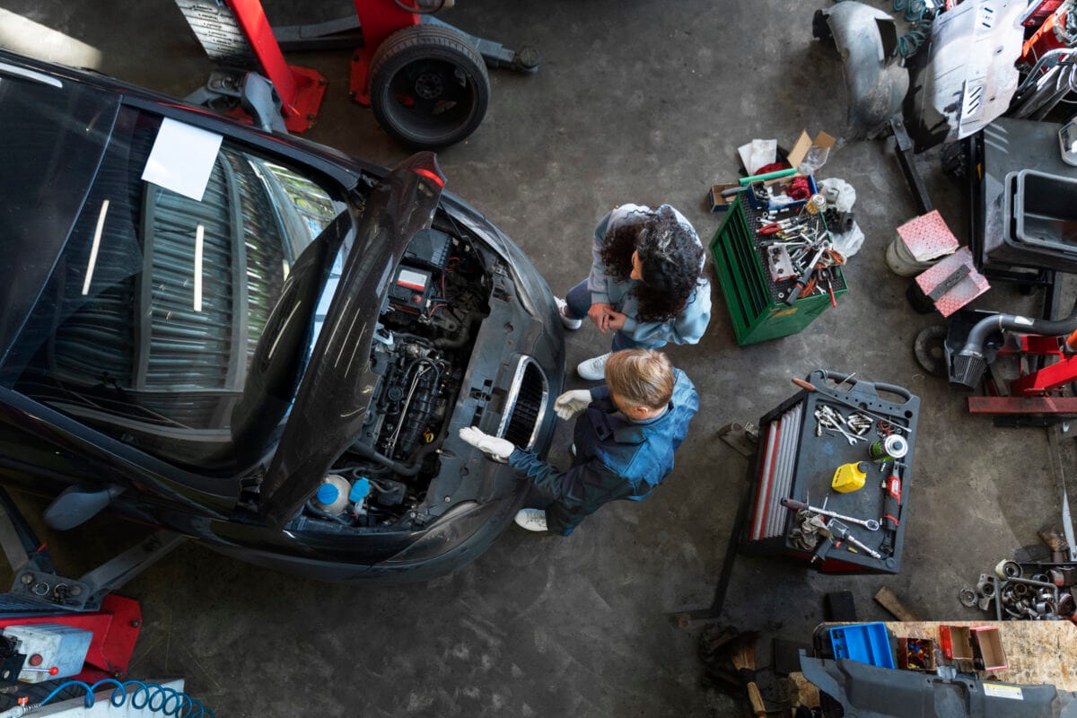 top view man repairing car (1)